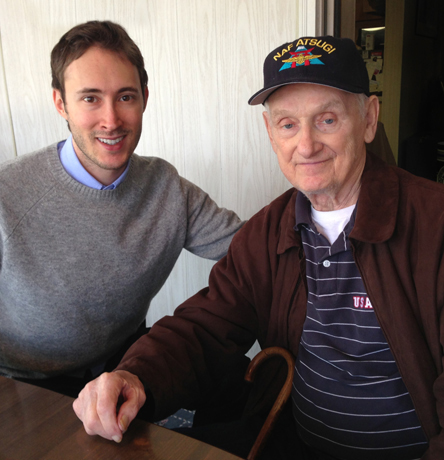 Adam sits with his grandfather Michael Makos.