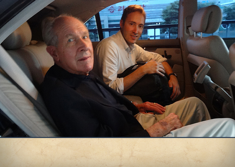 Adam Makos and Tom Hudner in a Mercedes transport provided by the North Koreans. 